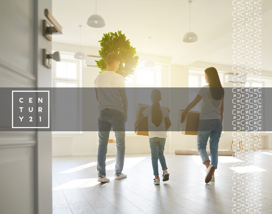 Happy-Family-with-Children-Moving-with-Boxes-in-a-New-Apartment-House.-Back-View-1